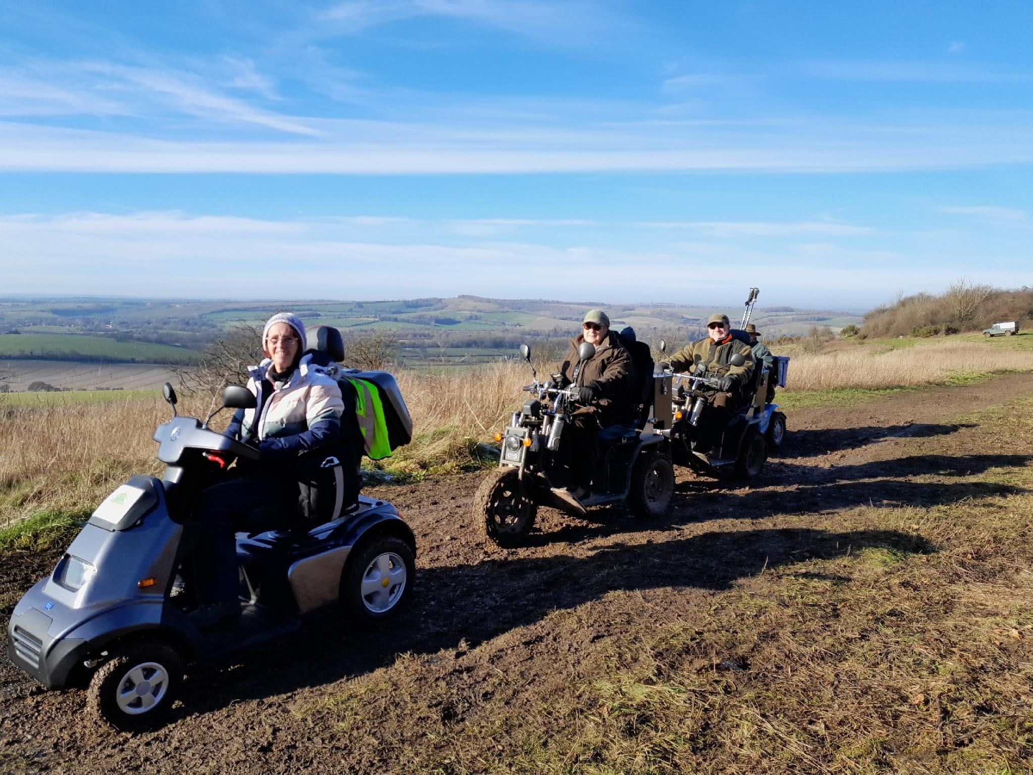3 invalid carriage users enjoying the countryside. 3 invalid carriage users enjoying the countryside.